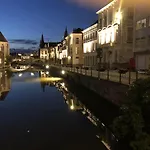 studio medieval city center at river de Leie